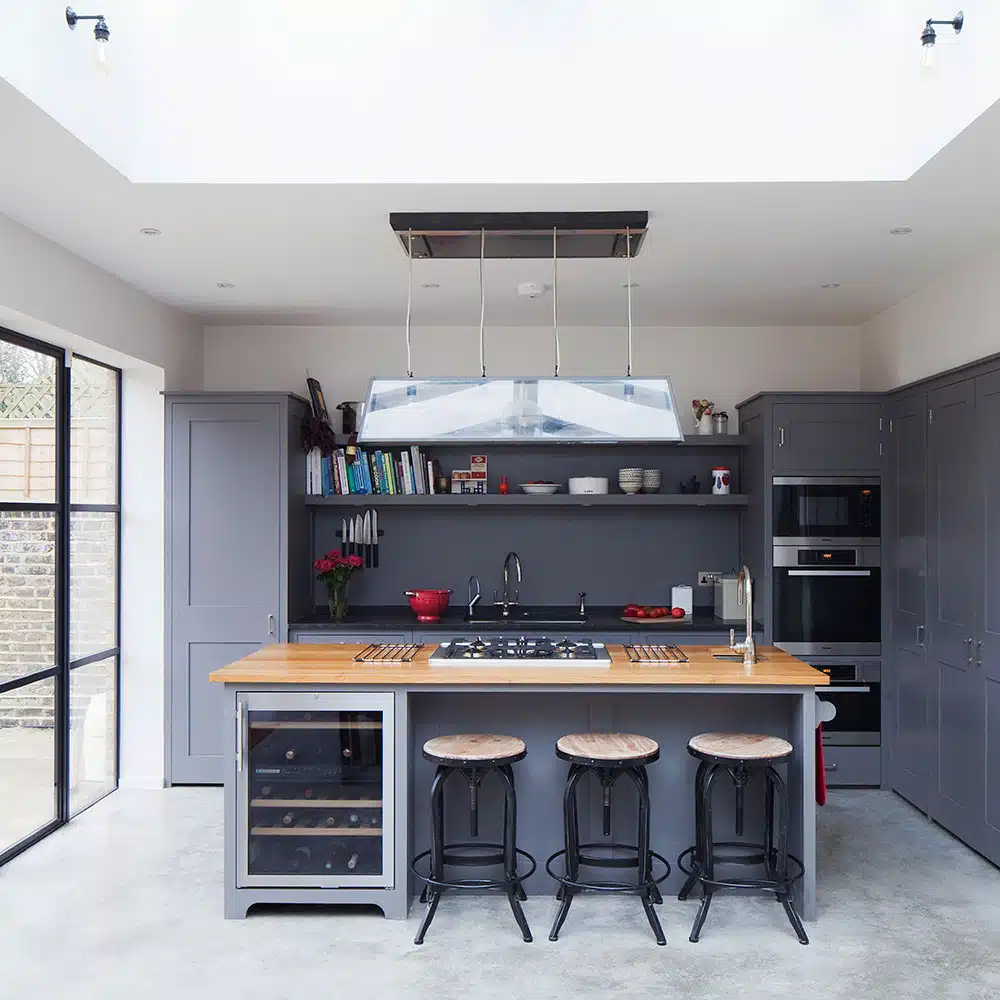 Kitchen makeover with grey Plain English units and concrete floors 5