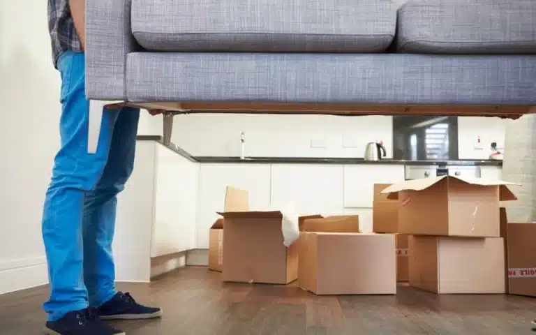 Man Carrying Sofa When Moving into New House 1080x675 1